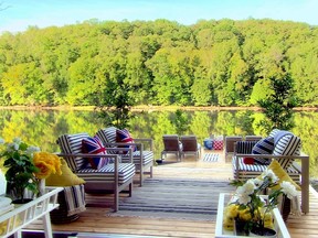 Carefully attired with contemporary outdoor furniture and jaunty toss pillows, the dock provides a cosy retreat.
