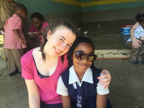 Submitted Photo
Nicholson Catholic College student, Olivia McPherson hugs a local child during the school’s week-long mission trip to Jamaica.