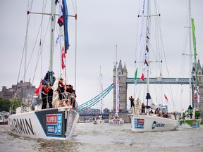 The yachts of the Clipper Round the World Yacht Race pass under Tower Bridge in London Sunday Aug. 30, 2015. The fleet leaves the London Sunday at the start of their 11 month, 40,000 nautical mile, global circumnavigation. (Chris Ison/PA via AP)