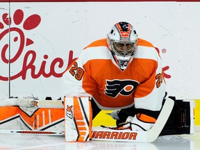 In this Jan. 27, 2015, file photo, Philadelphia Flyers goalie Ray Emery stretches before an NHL hockey game against the Arizona Coyotes in Philadelphia. (AP Photo/Tom Mihalek, File)