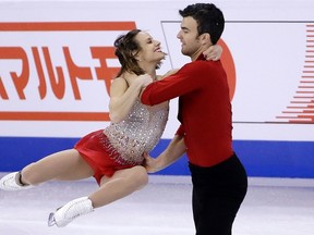 Meagan Duhamel and Eric Radford, of Canada, compete during the pairs short program at the World Figure Skating Championships at TD Gaden in Boston on April 1, 2016. (AP Photo/Elise Amendola)