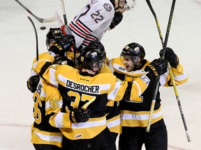Kingston Frontenacs celebrate Stephen Desrocher's power play goal as Oshawa Generals Anthony Cirelli skates away during game five of their Eastern Conference quarter-final Ontario Hockey League playoff series game at the Rogers K-Rock Centre in Kingston on Friday April 1 2016. Ian MacAlpine /The Kingston Whig-Standard/Postmedia Network