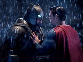 This image released by Warner Bros. Pictures shows Ben Affleck, left, and Henry Cavill in a scene from, "Batman v Superman: Dawn of Justice."  (Clay Enos/Warner Bros. Pictures via AP)