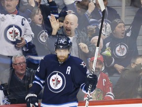 Winnipeg Jets right winger Blake Wheeler (26) celebrates his goal after scoring during the second period against the Chicago Blackhawks at MTS Centre. 
Mandatory Credit: Bruce Fedyck-USA TODAY Sports