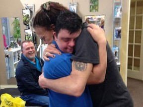 Aerosmith frontman Steven Tyler shares a hug with fan Anthony Yorfido during a chance encounter at Niagara Medical Supplies Inc. in Niagara Falls, Ont., March 31, 2016.