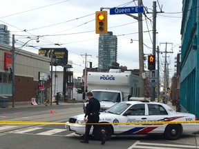 Toronto Police are investigating after a murder on Queen St. E. early Saturday (Chris Doucette/Toronto Sun)