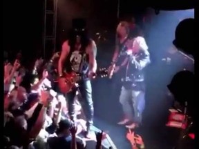 The classic Guns N' Roses lineup, including Axl Rose, Slash and Duff McKagen, reunites at the Trabadour in Los Angeles last night. (YouTube screengrab)
