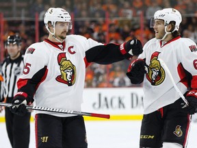 Ottawa Senators forward Mike Hoffman celebrates his power-play goal with Erik Karlsson during the third period against the Philadelphia Flyers Saturday, April 2, 2016, in Philadelphia. (AP Photo/Chris Szagola)