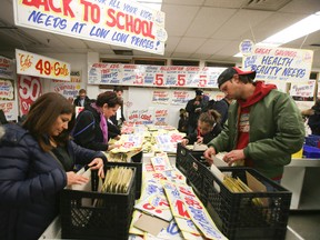 Honest Ed's hand-painted store signs are on sale this weekend. The store will close for good on Dec. 31 after 68 years in business. (Veronica Henri/Toronto Sun/Postmedia Network)