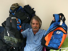 Ron Eldridge of Devoted To You Street Ministries with some 275 donated backpacks  on Thu., March 31, 2016. (Kevin King/Winnipeg Sun/Postmedia Network file)