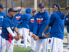Toronto Blue Jays pitchers Marcus Stroman, left to right, Aaron Sanchez and Jesse Chavez warm up at spring training in Dunedin, Fla., on Thursday, February 25, 2016. (THE CANADIAN PRESS/Frank Gunn)