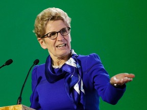 Ontario Premier Kathleen Wynne delivers her speech during a signing ceremony at the COP21, the United Nations Climate Change Conference on Dec. 7, 2015, in Le Bourget, north of Paris. (THE CANADIAN PRESS/AP/Christophe Ena)