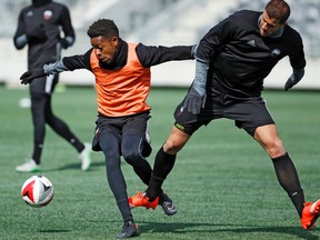 Fury FC’s Dennis Chin (left) tries to fend off teammate Rafael Alves during training at TD Place. (Darren Brown, Postmedia Network)
