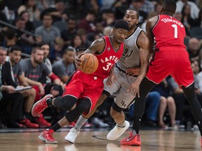 Toronto Raptors forward Terrence Ross (31) dribbles the ball around San Antonio Spurs forward Kawhi Leonard (2) during the second quarter at the AT&T Center. Mandatory Credit: Jerome Miron-USA TODAY Sports
