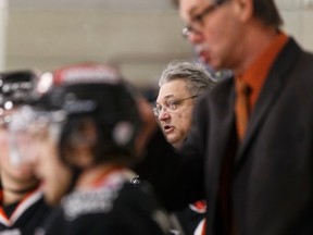 Lloydminster Bobcats coach and GM Gord Thibodeau directs his players during an AJHL playoff game between the Spruce Grove Saints and the Lloydminster Bobcats at Grant Fuhr Arena in Spruce Grove on Friday. (Ian Kucerak)