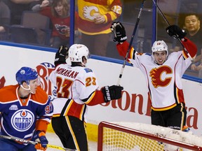 Calgary Flames forward Johnny Gaudreau celebrates his first of two goals with teammates on the way to a 5-0 shutout over the Edmonton Oilers in the final Battle of Alberta at Rexall Place on Saturday. (Ian Kucerak)