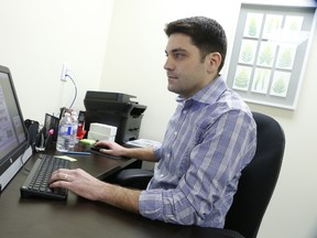 Joseph del Moral, director of the Canadian Cannabis Clinic, works at their 11th clinic that has opened in Mississauga on Thursday, March 31, 2016. (Jack Boland/Toronto Sun)