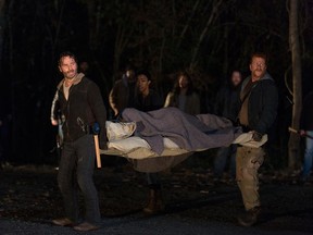 Rick Grimes (Andrew Lincoln), Sasha (Sonequa Martin-Green) and Abraham Ford (Michael Cudlitz) in Episode 16. (Photo by Gene Page/AMC)