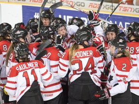 Team Canada celebrates after defeating Finland 5-3 in semifinal action at the women's world hockey championships in Kamloops, B.C., on April 3, 2016. (THE CANADIAN PRESS/Ryan Remiorz)
