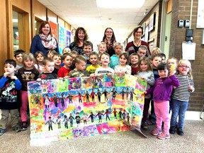 Students in the Upper Thames Elementary School Kindergarten ‘A’ class posed for a picture after winning third place in Community Living Ontario's “Together, We're Better” contest. Aiding the students with their contest submission (and pictured in the back row) were kindergarten teacher Courtney Pickard (left), educational assistant Angie Jackson, early childhood educator Jamie Dow and educational assistant Sue Heckman. Missing from the photo was Kindergarten A teacher Karen Hocking. SUBMITTED