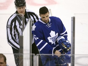 Toronto Maple Leafs center Nazem Kadri is escorted to the penalty box by linesman Scott Driscoll after receiving a cross-checking penalty against the Detroit Red Wings at Air Canada Centre in Toronto on April 2, 2016. (Tom Szczerbowski/USA TODAY Sports)