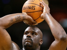 In this March 9, 2007, file photo, Miami Heat center Shaquille O'Neal shoots a free throw during an NBA basketball game in Miami. (AP Photo/J. Pat Carter, File)