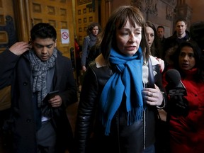 Actress Lucy DeCoutere, a complainant in the case against former Canadian radio host Jian Ghomeshi, leaves the court after an Ontario judge found him not guilty on four sexual assault charges and one count of choking, in Toronto, March 24, 2016. (REUTERS/Mark Blinch)