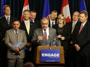 Ric McIver (middle/at podium), Interim Party Leader, and the Alberta Progressive Conservative Party Caucus, launched a new public engagement initiative at the Alberta Legislature on April 4, 2016. (PHOTO BY LARRY WONG/POSTMEDIA NETWORK)