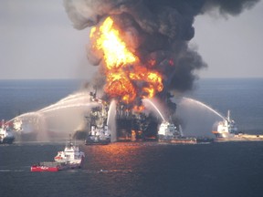 Fire boat response crews battle the blazing remnants of the off shore oil rig Deepwater Horizon, off Louisiana, in this file handout photograph taken on April 21, 2010.  REUTERS/U.S. Coast Guard/Handout