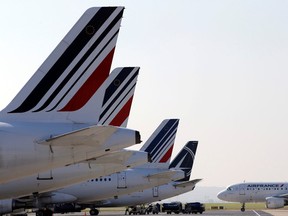 In this Sept.15, 2014 file photo, Air France planes are parked on the tarmac of the Paris Charles de Gaulle airport, in Roissy, near Paris. (AP Photo/Christophe Ena)