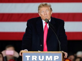 Republican presidential candidate Donald Trump pauses as he speaks Monday, April 4, 2016, at a campaign rally in Superior, Wis. (AP Photo/Jim Mone)