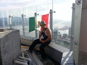 Diego Saul Reyna climbed to the top of the Trump tower in Vancouver to send Donald Trump a message. (Facebook/Vancouver Sun)