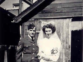 A photo from late April 1946, in front of the garage at 593 Bagot Street (home of Tom's parents).  His parents weren't able to travel to New Brunswick for the wedding so this is the first they saw Mary and Tom in their wedding attire.