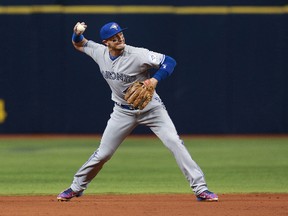 Toronto Blue Jays shortstop Troy Tulowitzki throws the ball to first base for one of his seven assists against the Tampa Bay Rays on April 3, 2016. (KIM KLEMENT/USA Today Sports)