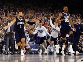 Villanova’s Jalen Brunson (1), Mikal Bridges (25) and their teammates celebrate after beating North Carolina in the NCAA championship game Monday, April 4, 2016, in Houston. (AP Photo/David J. Phillip)