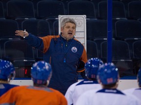 Oilers head coach Todd McLellan talks to players during practice Monday at Rexall Place. (Ryan Wellicome)