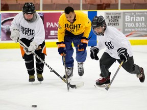 Oilers D-man Darnell Nurse skates with youth from the Alexander First Nation at Servuis Credit Union Pladce in St. Albert Monday as part of his involvement with Right to Play. (Ian Kucerak)