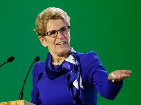 Ontario Premier Kathleen Wynne, delivers her speech during a signing ceremony at the COP21, the United Nations Climate Change Conference on Dec. 7, 2015 in Le Bourget, north of Paris.  (AP Photo/Christophe Ena)