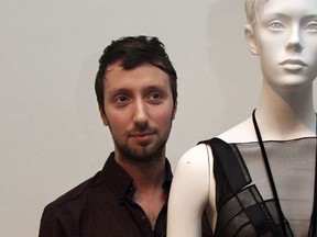 (FILES) A file picture taken on March 2, 2010 in Paris, shows Belgian designer Anthony Vaccarello standing behind one of his creations during the autumn-winter 2010 ready-to-wear collection show. Vaccarello was appointed as the new creative director of Yves Saint Laurent. (AFP PHOTO/PIERRE VERDY)
