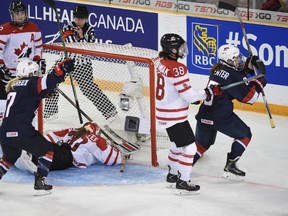 United States's Alex Carpenter celebrates her overtime goal against Canada in gold medal action at the women's world hockey championships Monday, April 4, 2016 in Kamloops, B.C. THE CANADIAN PRESS/Ryan Remiorz