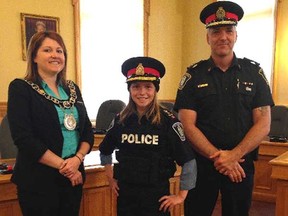 Mayor Heather Jackson, left, welcomes St. Thomas Police Chief for the Day Emily Campeau and Chief Darryl Pinnell after the 12-year-old's swearing-in ceremony last year at city hall.
