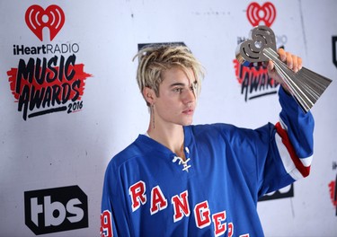 Justin Bieber shows off his new dreadlocks at the iHeartRadio Music Awards in Los Angeles, California. (Brian To/WENN.COM)