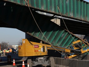 The scene of a fatal construction accident which occurred underneath the I-90 expressway at Touhy Road in Des Plaines, Il., early Tuesday, April 5, 2016. Police say a construction worker was killed and three others injured when a 45-ton beam fell on the crew of workers. (Antonio Perez/Chicago Tribune via AP)