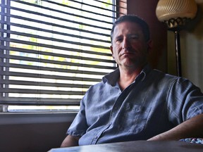 In this photo taken March 24, 2016, Keith Gartenlaub is seen at his home in Lake Elsinore, Calif. FBI agents investigating a potential data leak at Boeing obtained a secret warrant to search the home computers of Gartenlaub, a company manager in California, for evidence they hoped would connect him to Chinese economic espionage.  (AP Photo/Lenny Ignelzi)