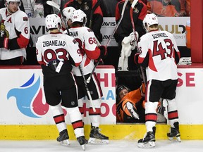 Philadelphia Flyers center Nick Cousins tries to get up after getting checked into the Ottawa Senators bench during third-period NHL action at Wells Fargo Center in Philadelphia on April 2, 2016. (Herik Hamilton/USA TODAY Sports)