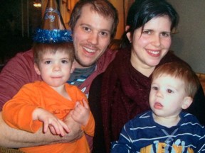 A family supplied photo of Roger Belanger, his widow Justine, and his two sons, Sebastien and Nikolas.