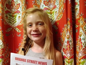 In this September 2015, photo provided by Matthew Lysiak, Hilde Kate Lysiak poses for a photo at her home in Selinsgrove, Pa. Lysiak, a 9-year-old reporter, recently wrote about a suspected murder in her small Pennsylvania town and is defending herself after some locals lashed out about a young girl covering violent crime. (Isabel Rose Lysiak via AP)