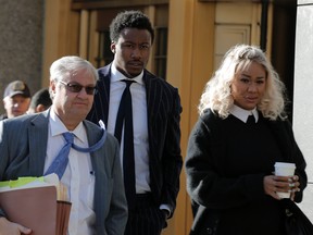 New York Jets wide receiver and television host Brandon Marshall arrives for a civil trial, with his wife Michi Nogami at the Manhattan Federal Courthouse in New York April 5, 2016. (REUTERS/Brendan McDermid)