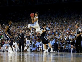 North Carolina Tar Heels’ Marcus Paige’s game-tying three-point shot was topped seconds later by Villanova’s Kris Jenkins (left) game-winning shot. (USA TODAY)