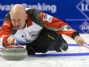 Canada's skip Kevin Koe competes in a round-robin match against Germany at the men's world curling Championship in Basel, Switzerland on Tuesday, April 5, 2016. (Georgios Kefalas/Keystone via AP)